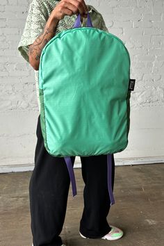 Experience the ultimate in convenience and sustainability with our Upcycled Packable Backpack in Teal, perfect for your everyday transit needs. Made from high-quality sustainable materials, this backpack is not only functional but also environmentally friendly. Details: Sustainable Packable Backpack Padded Straps Fold into pocket Fabric Content: Upcycled Nylon, 3-D Knit, Upcycled Chaco® Straps Waste Diversion: 0.6 lbs. Dimensions: 19"L X 4"W X 12" H Note: Each colorway is extremely limited in av Functional Green Backpack With Water Bottle Pocket, Green Backpack With Water Bottle Pocket For Everyday Use, Green Everyday Backpack With Water Bottle Pocket, Practical Green Nylon Backpack, Functional Nylon Backpack With Recyclable Material, Functional Recyclable Nylon Backpack, Green Backpack With Water Bottle Pocket For Outdoor Activities, Green Nylon Backpack With Functional Pockets, Functional Green Backpack For Commuting