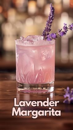 lavender margarita in a glass with ice and garnish