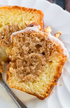 two pieces of cake on a plate with a fork