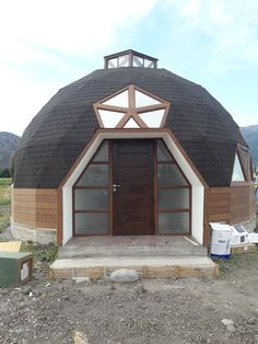 a large round building with a wooden door