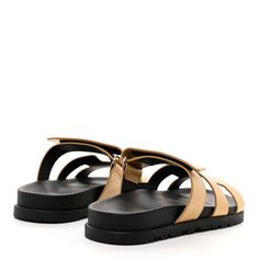 This is an authentic pair of HERMESMetallic Goatskin Womens Chypre Sandals 36.5 in Dore. These stylish sandals are crafted of metallic leather in gold. They feature a toe strap across-over large Hermes H and an adjustable strap. Stylish Sandals, Metallic Leather, Adjustable Straps, Sandals, Leather, Gold