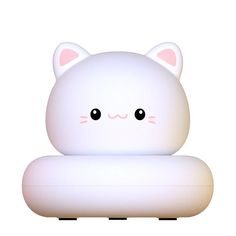 a white cat light sitting on top of a table