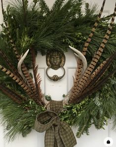 a wreath is hanging on the front door