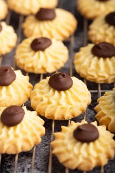 some cookies are cooling on a rack with chocolate