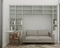 a living room with a couch and bookshelves on the wall next to a desk