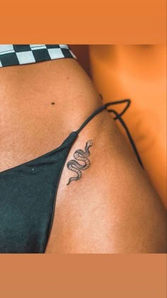 a woman with a snake tattoo on her stomach and side view of the lower half of her body