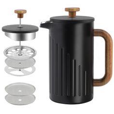 a black french press coffee maker with wooden handle and lid next to it's accessories