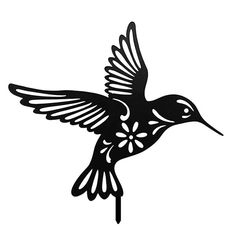 a black and white image of a hummingbird flying in the air with its wings spread out