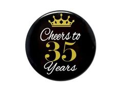 a badge that says cheers to 35 years with a crown on the front and white lettering