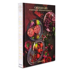 the book cover is shown with various fruits and vegetables on it, including pomegranates