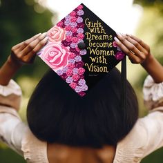 a woman wearing a graduation cap that says girls with dreams become women with vision on it