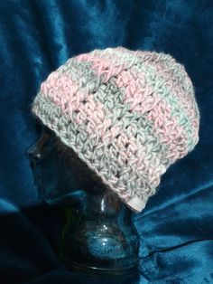 This is a gorgeous Adult sized (medium to large), unisex, hand crocheted beanie in pale pink, cream and pale sage green tones. Perfect to keep your head warm in cold weather. Made using Patons Sierra chunky yarn (20% wool and 80% acrylic) .  The beanie measures approximately 56 cm x 25cm. There is a lot of stretch is this hat due to the design.  Gentle warm machine wash or hand wash is recommended. Do not rub. Do not bleach. Do not tumble dry. Dry flat in shade. Cool iron. Dry cleanable.  The it Pink Knitted Crochet Yarn Hat, Pink Crochet Hat In Acrylic Yarn, Warm Pink Crochet Hat, Pink Hand Knitted Crochet Beanie Hat, Pink Hand-knitted Crochet Beanie Hat, Pink Crochet Beanie For Winter, Hand Knitted Pink Crochet Beanie Hat, Handmade Yarn Beanie For Spring, Cozy Warm Pink Crochet Hat