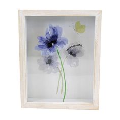 a white frame with blue flowers in it