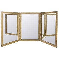 an open wooden window with mirrors on the sides and one side opened to show it's reflection