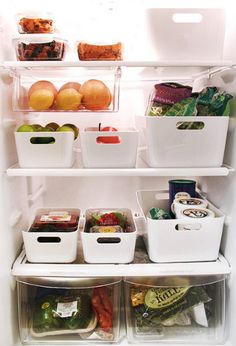 an open refrigerator filled with lots of different types of food and drinks in containers on the shelves