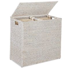 a white wicker storage box with two open doors and handles on the front side