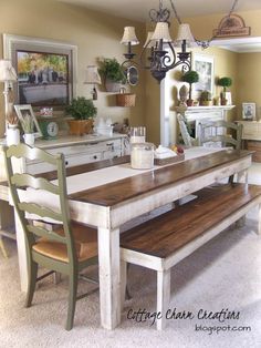 a dining room table with two benches in front of it