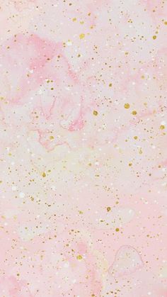 a pink and gold background with lots of dots