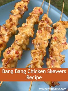 chicken skewers on a blue plate with the words bang bang chicken skewers recipe