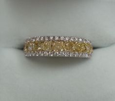 a fancy yellow and white diamond ring