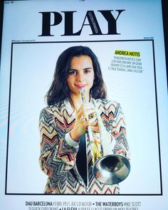 the front cover of play magazine with an image of a woman holding a trumpet