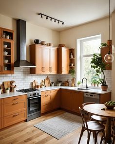 a kitchen filled with lots of wooden cabinets and counter top space next to a window