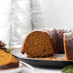 a bundt cake on a plate with a slice cut out