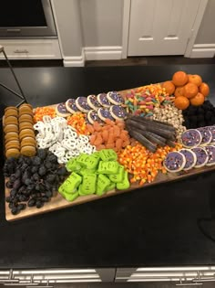 a platter filled with lots of different types of food on top of a counter