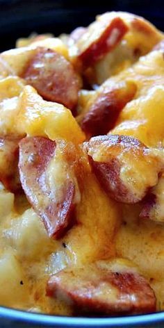 a close up of a plate of food with cheese and bacon