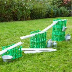 some green and white plastic containers in the grass