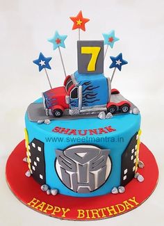 a birthday cake for a seven year old boy with a truck and stars on top