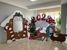 christmas decorations in an office decorated with gingerbread house and snowman on the door