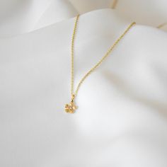 A lifetime piece, this necklace is made of all 14k gold and features a lovely Cosmos flower with a bright diamond center. Gift box included. Diamond Weight: 0.045 Carat Color: G Quality: SI-VS Non-Conflict Diamonds Chain measures 1 mm in width. Flower measures 7 mm in diameter. --------------------♥ PROMOS ♥-------------------- Want 10% off? Join the mailing list by visiting http://bit.ly/vedern . Your discount code will work on Vedern at Etsy. --------------------♥ BUY WITH CONFIDENCE ♥-------------------- Don't love it? Message me to set up a return or exchange. If you find any problems with your items, just send a message with a photo, and a new one will be on its way to you! --------------------------♥ PACKAGING ♥--------------------------- Gold filled, vermeil, and sterling silver ite Flower Shaped Diamond Necklace For Gift, Flower-shaped Diamond Necklace For Gifts, Elegant Flower-shaped Diamond Necklace As Gift, Fine Jewelry Flower-shaped Diamond Necklace Gift, Fine Jewelry Diamond Necklace With Flower Shape For Gift, Flower Shaped Diamond Necklace Gift, Delicate Yellow Gold Flower Necklace, Yellow Gold Flower Pendant Necklace As Gift For Her, Yellow Gold Necklace With Flower Pendant For Her