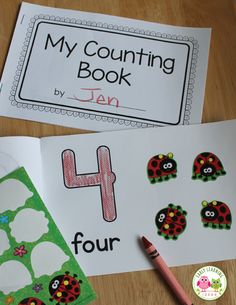 a book with ladybugs and numbers on it next to a crayon marker