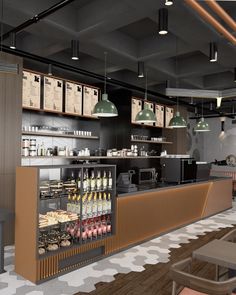 the interior of a coffee shop with lots of counter space and hanging lights above it