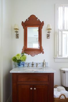 a bathroom with a sink, mirror and window in it's center piece is featured on instagram