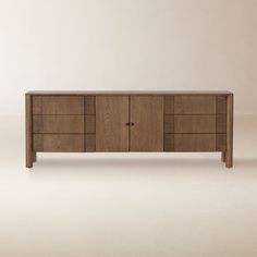 the sideboard is made out of wood and has three drawers, one with two doors