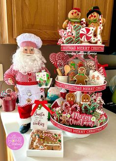 there is a christmas tree made out of cookies and other holiday treats on the counter