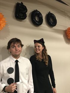 a man and woman are dressed up for halloween