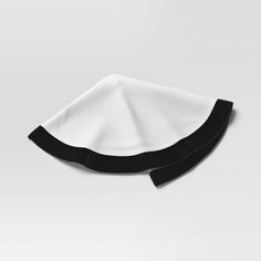 two black and white napkins sitting on top of each other