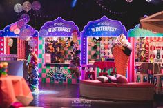 an assortment of christmas decorations in front of a window display at the mall for winterfest