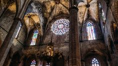 the interior of an old church with stained glass windows