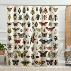 a shower curtain with many different bugs on it