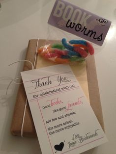 there is a box with some candy in it and a thank you note on the package