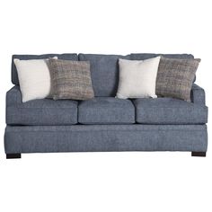 a blue couch with four pillows on it