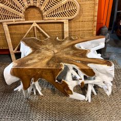 a table made out of wood with white and brown paint on it's surface