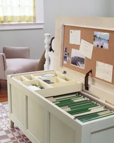 an open drawer with some papers in it