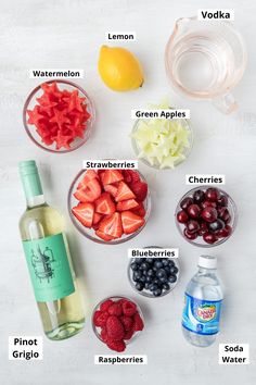 the ingredients to make this fruit salad are shown in bowls, including strawberries, lemons, blueberries, raspberries, and water