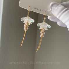 Jellyfish Dangle Earrings - Cute Lightweight Jellyfish drop Earrings - Unique Earrings - Beach vibes Earrings 🤍 Hypoallergenic 🌸 Handmade with love ✨ Cute & Dainty  🎁 Gift ready 〰️Click👇🏻 Find more Earrings🎀  https://www.etsy.com/shop/byYeeSo ◽️ PACKAGING ◽️  * The jewelry will be nicely packaged * Comes with a drawstring suede pouch * If you need personalized gift note, please click the link below, add it to your cart when check out to upgrade your packaging. https://www.etsy.com/listing/1008661207/upgrade-gift-packaging?ref=shop_home_active_1&frs=1 ◽️ SHIPPING ◽️ * USPS First Class Shipping Service with tracking number ◽️ CARE INSTRUCTIONS ◽️ * Avoid perfumes or sprays * Avoid getting your jewelry wet * Wipe down the jewelry to remove oils and prevent tarnish * Store jewelry in a c Jellyfish Earrings, Shrink Plastic Jewelry, Earrings Beach, Small Lanterns, Store Jewelry, Ocean Jewelry, Plastic Jewelry, Funky Jewelry, Earrings Cute