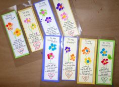 four bookmarks with flowers and hearts on them